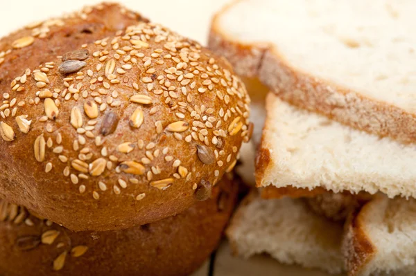 Organic bread over rustic table — Stock Photo, Image