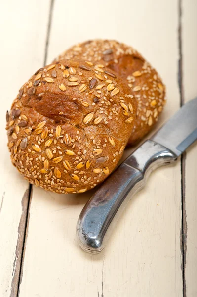 Organic bread over rustic table — Stock Photo, Image