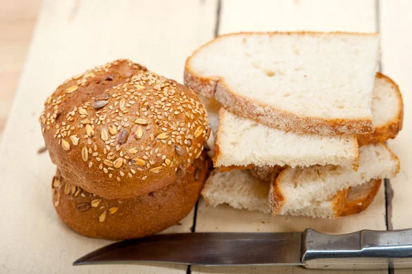 Organic bread over rustic table — Stock Photo, Image