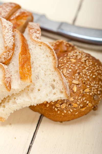 Organic bread over rustic table — Stock Photo, Image