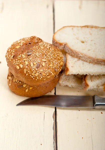 Organic bread over rustic table — Stock Photo, Image