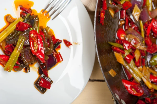 Fried chili pepper and vegetable on a wok pan — Stock Photo, Image