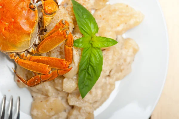 Italian gnocchi with seafood sauce with crab and basil Royalty Free Stock Photos