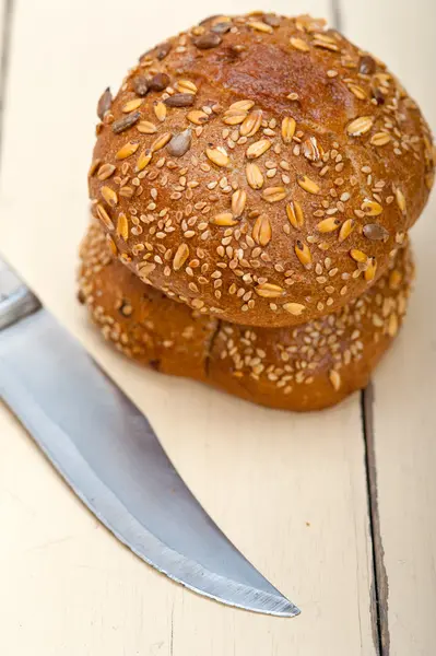 Organic bread over rustic table — Stock Photo, Image