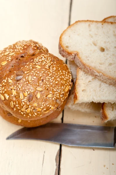 Organic bread over rustic table — Stock Photo, Image