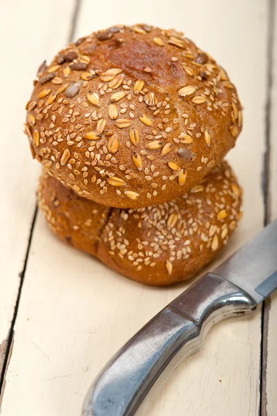 Organic bread over rustic table — Stock Photo, Image