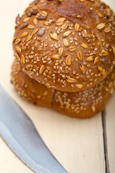 Organic bread over rustic table — Stock Photo, Image