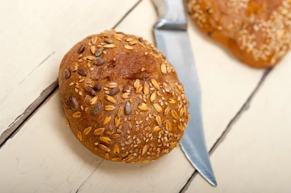 Organic bread over rustic table — Stock Photo, Image