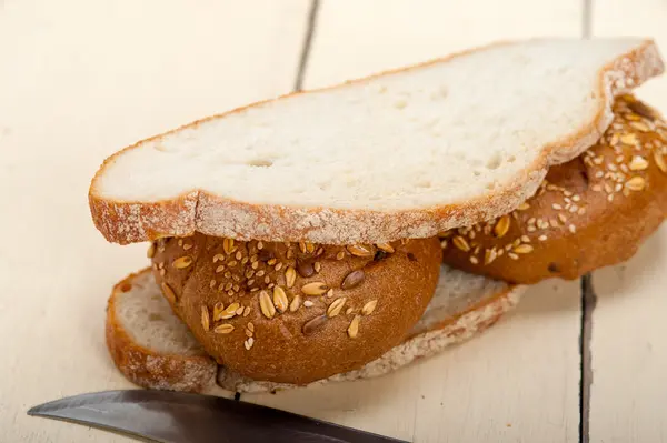 Organic bread over rustic table — Stock Photo, Image