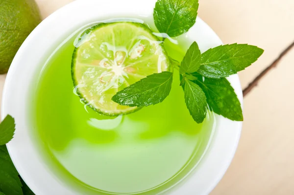 Mint infusion tea tisane with lime — Stock Photo, Image