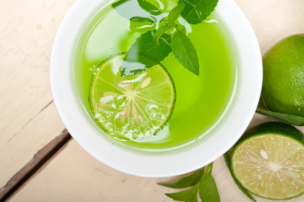 Mint infusion tea tisane with lime — Stock Photo, Image