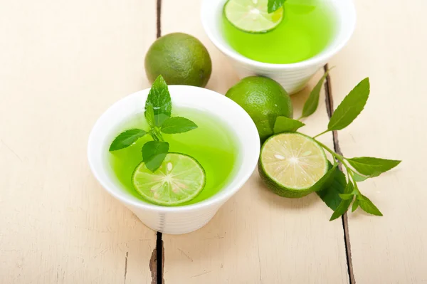 Mint infusion tea tisane with lime — Stock Photo, Image