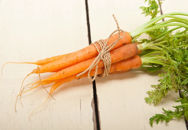 Baby carrots bunch tied with rope — Stock Photo, Image