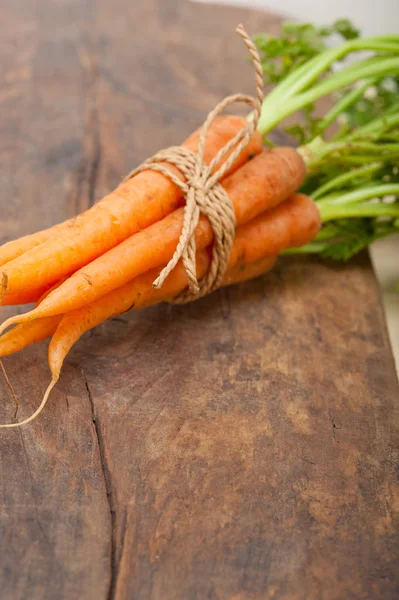 Baby carrots bunch tied with rope — Stock Photo, Image