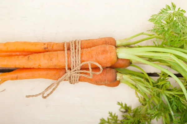 Baby carrots bunch tied with rope — Stock Photo, Image