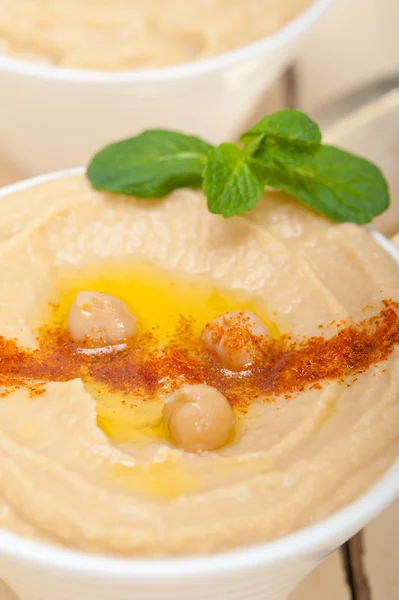 Hummus with mint on top — Stock Photo, Image