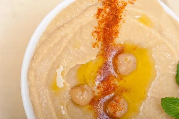 Hummus with mint on top — Stock Photo, Image