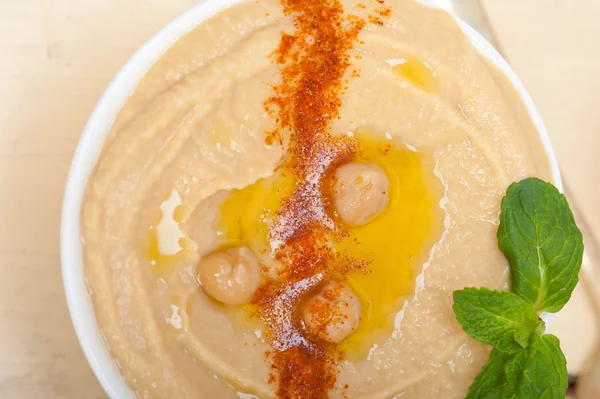 Hummus with mint on top — Stock Photo, Image