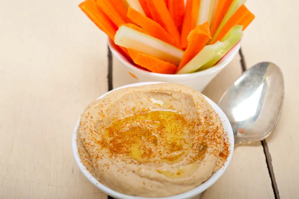 Fresh hummus dip with raw carrot and celery — Stock Photo, Image