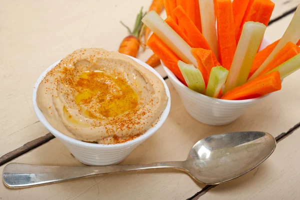 Fresh hummus dip with raw carrot and celery — Stock Photo, Image