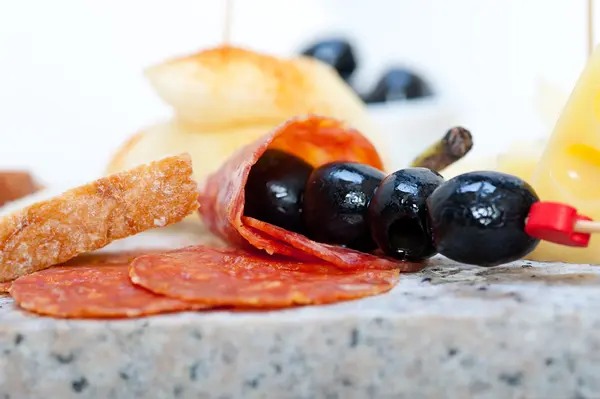 Mix cold cut on a stone with fresh pears — Stock Photo, Image