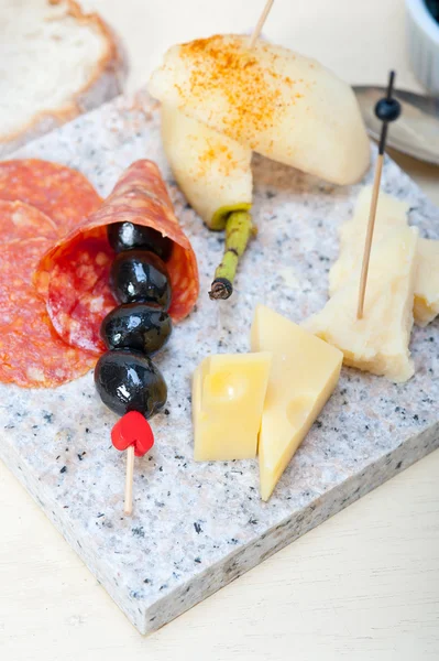 Mix cold cut on a stone with fresh pears — Stock Photo, Image