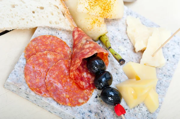 Mix cold cut on a stone with fresh pears — Stock Photo, Image