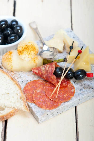 Mix cold cut on a stone with fresh pears — Stock Photo, Image