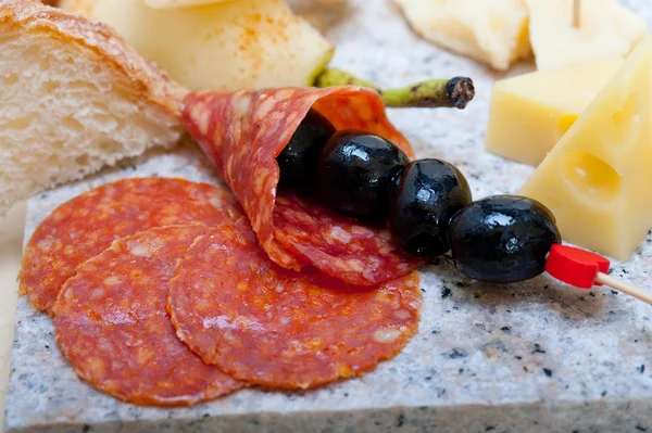 Mix cold cut on a stone with fresh pears — Stock Photo, Image