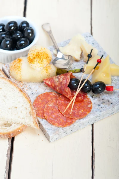 Mix cold cut on a stone with fresh pears — Stock Photo, Image