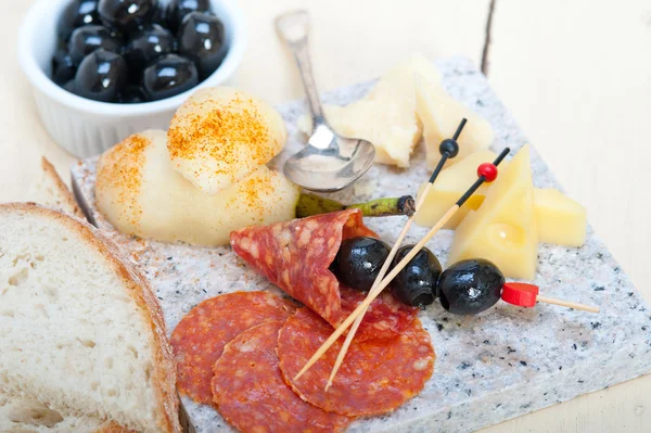 Mix cold cut on a stone with fresh pears — Stock Photo, Image