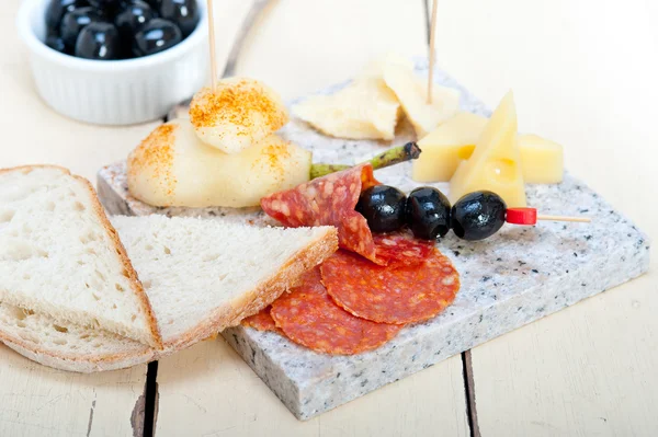 Mix cold cut on a stone with fresh pears — Stock Photo, Image