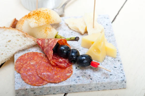 Mix cold cut on a stone with fresh pears — Stock Photo, Image