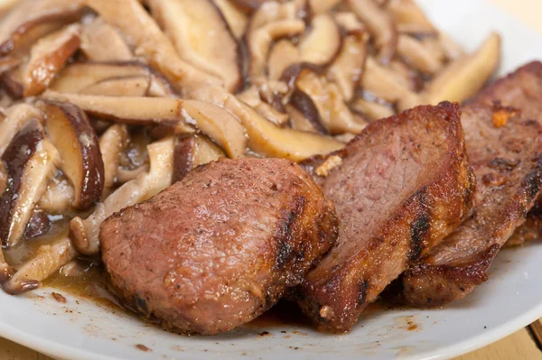 Venison deer game filet and wild mushrooms — Stock Photo, Image