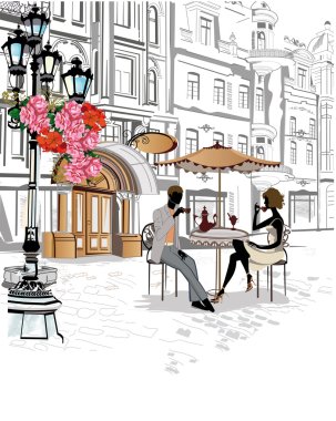 Adam ve kadın oturuyor ve sokak bir kafede kahve içme.