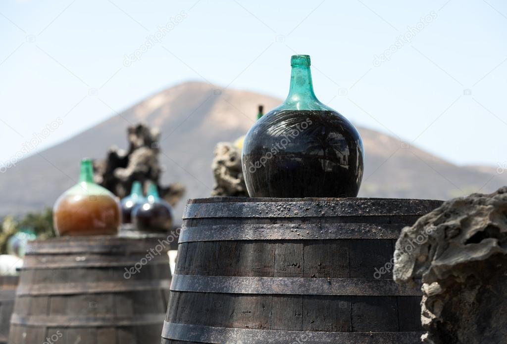 Barrels and  big bottles with grape wine - malvasia.  Lanzarote