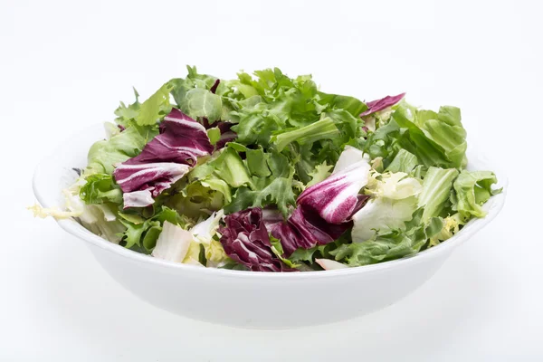 Green and red leaf of lettuce . Isolated on a white background — Stock Photo, Image