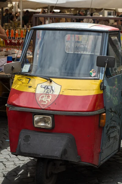 Piaggio Ape50 in Rome. Piaggio Ape is a three-wheeled light commercial vehicle first produced in 1948 by Piaggio. — Stock Photo, Image