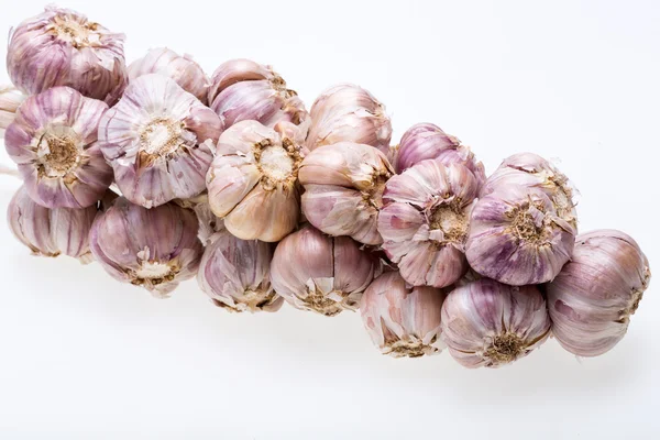 String of garlic isolated on white background — Stock Photo, Image