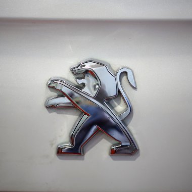 Peugeot metallic logo closeup on Peugeot  car  clipart