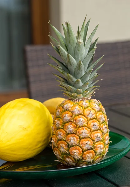 Assortment of fresh exotic fruits on  black table — Stock Photo, Image