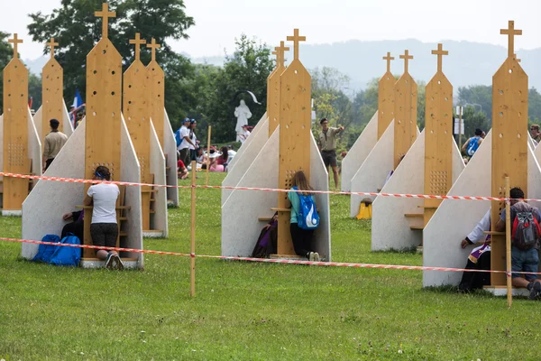 Pilgrims in Zone of Reconciliation at Sanctuary of Divine Mercy in Lagiewniki. WYD participants will be able to confess to more than 50 confessionals. Cracow Poland