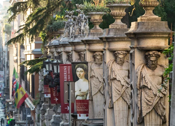 Fencing of Palazzo Barberini (Galleria Nazionale d'Arte Antica) with columns with the image atlantes, Rome, Italy. — Stock Photo, Image