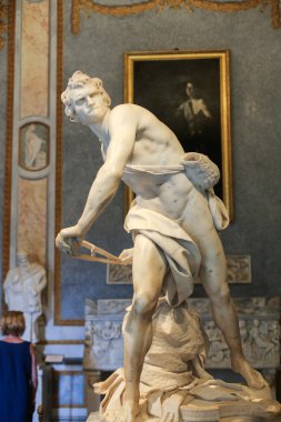 Marble sculpture David  by Gian Lorenzo Bernini  in Galleria Borghese, Rome, Italy clipart