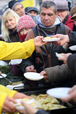 Christmas Eve for poor and homeless on the Central Market in Cracow. Every year the group Kosciuszko prepares the greatest eve in the open air in Poland clipart