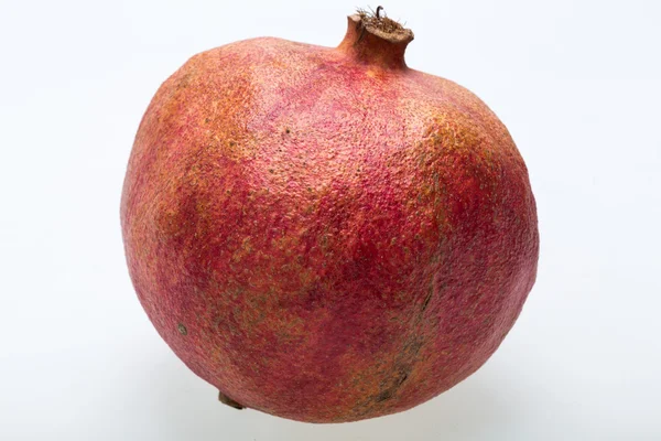 Red pomegranate isolated on a white background — Stock Photo, Image