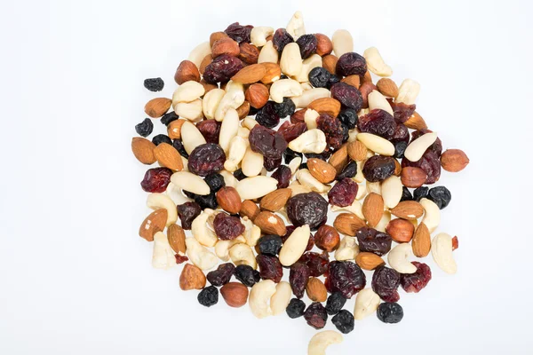 Mixed nuts and dried fruits isolated on white background — Stock Photo, Image