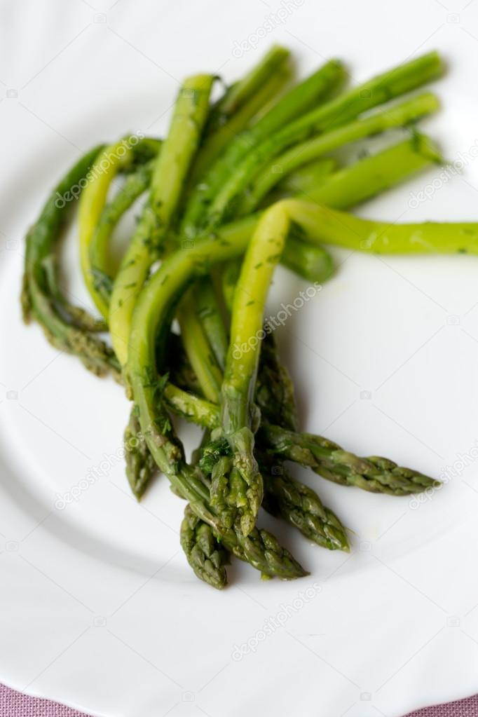Green asparaguses with the fresh dill