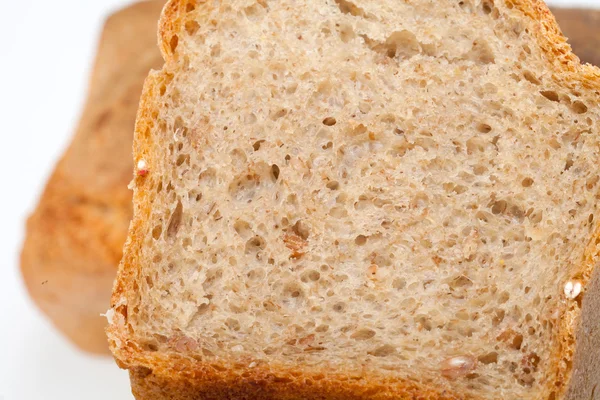 Loaves of bread traditionally roasted.  Background. Close up. — Stock Photo, Image