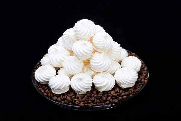French vanilla meringue cookies and  coffee beans — Stock Photo, Image